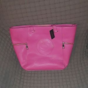 This is a hot pink bebe Tote. With mini bag.